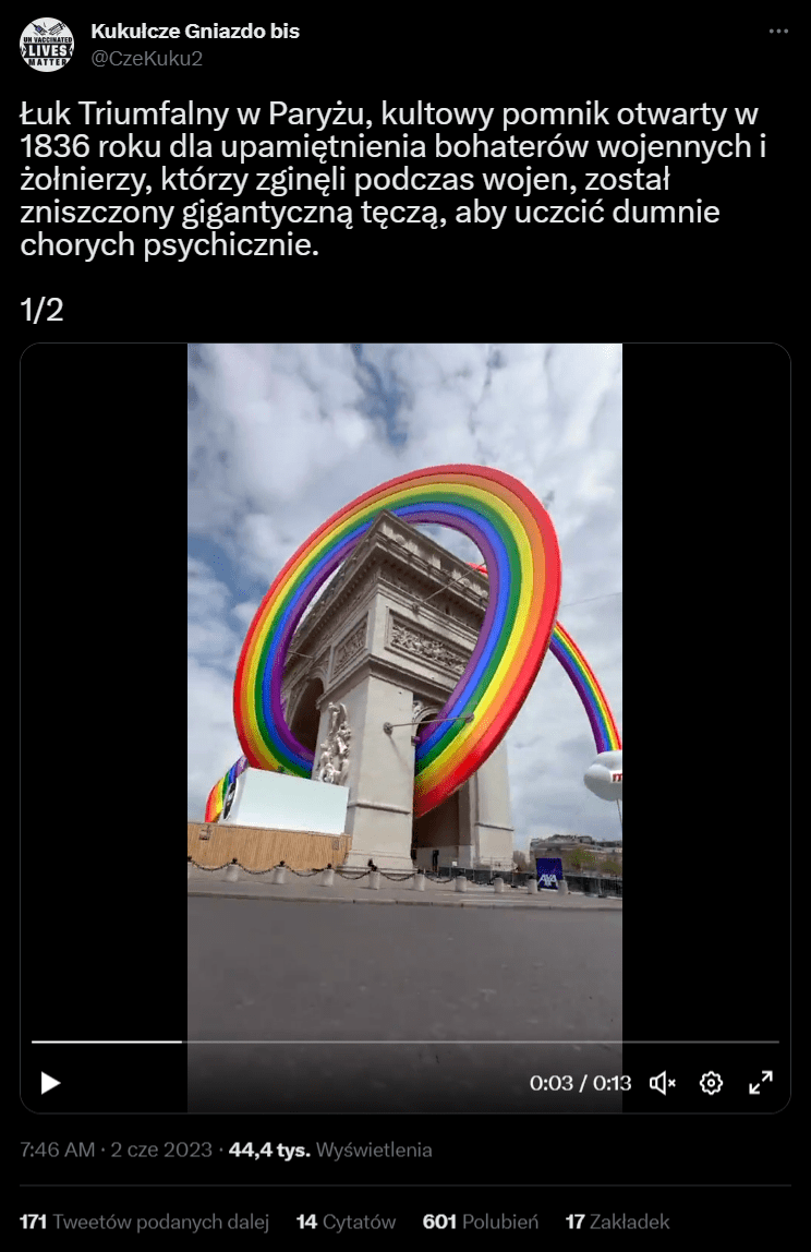Zrzut ekranu z posta na Twitterze. Nagranie przedstawiające Łuk Triumfalny w tęczy. W opisie informacja o dewastacji budynku.