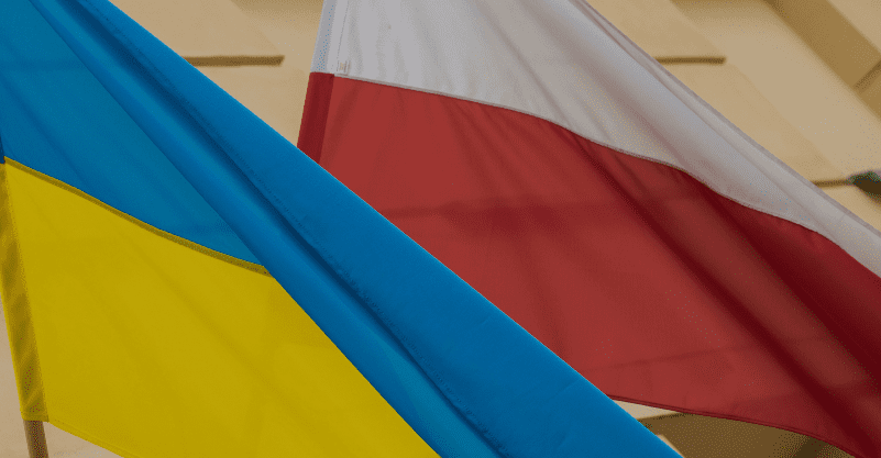 na grafice flaga Ukrainy i flaga Polski