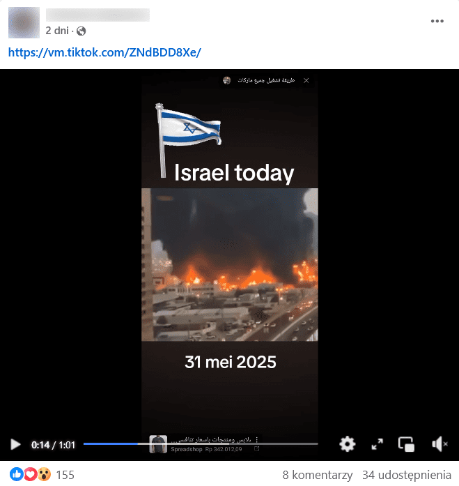 Zrzut ekranu wpisu na Facebooku. Klatka z udostępnionego nagrania dużego miejskiego pożaru. Nad płomieniami, w powietrze unosi się duża ilość dymu.